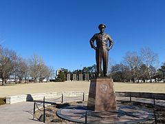 Eisenhower statue in "Champion of Peace" circle, with memorial pylons in background