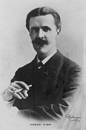 Head and upper body portrait of a middle-aged man with dark hair and heavy moustache, holding a cigarette in his right hand