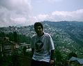 The photographer himself, Amir the Mysterious, behind him city of Darjeeling, also known as The "Tea City".