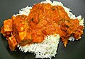 Image 16Chicken tikka masala, served atop rice. An Anglo-Indian meal, it is among the UK's most popular dishes. (from Culture of the United Kingdom)