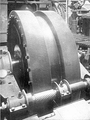 A pair of large helical gears in a ship's engine room, mounted herringbone-fashion