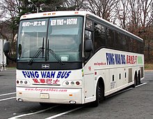 A large white bus, seen from the front