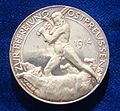 Reverse of a German silver medal commemorating the liberation of East Prussia in 1914 by Paul von Hindenburg. The naked General Hindenburg is fighting the Russian Bear with his sword.