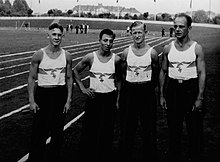 four men wearing athletic clothes with eagle and swastika