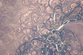 Meanders: dramatic meander scars and oxbow lakes in the broad flood plain of the Rio Negro, seen from space