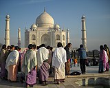 K-22. Female tourists from North-East India, in sarongs and shawls, at the Taj Mahal.