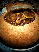 Curry chicken in a big bread provided by a Macao restaurant