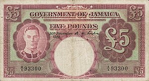 Purple coloured banknote showing image of George VI