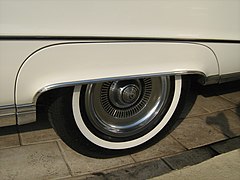Buick Electra with white stripe tire partially covered by a fender skirt