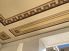 A photo of the decoration painted under the portico of the building.