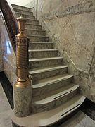 Marble stairway with bronze ornamentation