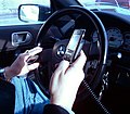 Image 47A New York City driver holding two phones (from Smartphone)