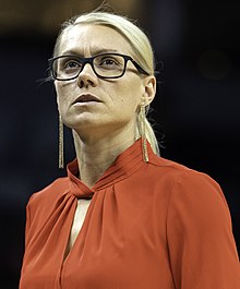 Close-up photo of Phillips wearing glasses while coaching