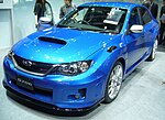 Subaru WRX STI S206, a high-performance variant of the standard Subaru WRX STI sedan. This photo shows the front of the car, which is blue; there is a "S206" badge on the front grille.