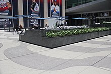 Alternating bands of white and gray tiles in the sidewalk of the plaza outside 1271 Avenue of the Americas