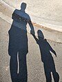 Shadow of a parent and child