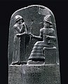 Al re Hammurabi cun un dignitàri ins a la préda cun l' iscrisiòun dal só còdes ed léś