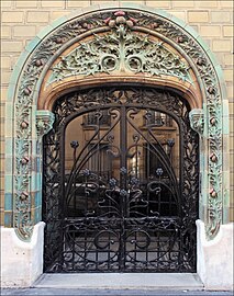 French Art Nouveau - Entrance decorated with glazed tiles of the Les Chardons Building (Rue Eugène-Manuel no. 2), Paris, 1903, by Charles Klein[67]