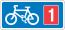 Rectangular, blue traffic sign with a white bicycle symbol and a red square with the number 1 in it.