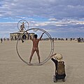 Image 22Naked participant at Burning Man 2016 posing as Leonardo da Vinci's Vitruvian Man (from Naturism)