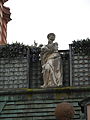Statue at roof level.