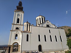 Mostar cathedral, the white church with black roof in the background, 1890-1900
