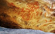 A Prehistoric cave painting in Bhimbetka rock shelters.