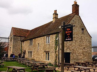 Colour photograph of the only extant monastic building from Littlemore Priory seen as a pub in 2009