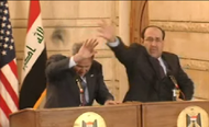 President George W. Bush ducking a thrown shoe, while Prime Minister Nouri al-Maliki attempts to catch it.