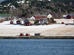 Coastal farm area along the fjord.
