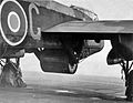 Upkeep bouncing bomb in position in the bomb bay of Guy Gibson's Lancaster – serial ED932/G, code 'AJ-G'