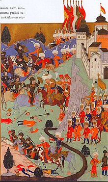 Horsemen and infantry fighting at a fortress on a river