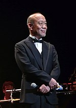 Joe Hisaishi at a 2011 concert