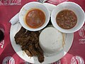 Image 6Ugali, served here with beef and sauce, is a mainstay of the cuisine throughout the African Great Lakes region. (from Culture of Kenya)