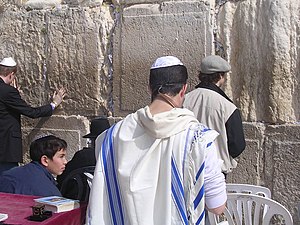 Blue stripes on a traditional Jewish tallit. The blue stripes are also featured in the flag of Israel.