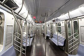 R179 car has numerous handholds and looped stanchions for high capacity (New York City)