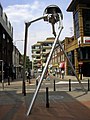 Image 40Statue of a tripod from The War of the Worlds in Woking, England, the hometown of author H. G. Wells. The book is a seminal depiction of a conflict between mankind and an extraterrestrial race. (from Culture of the United Kingdom)