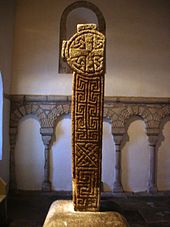 Photo of an inscribed high cross within a church