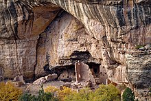 A color picture of a large sandstone cliff dwelling