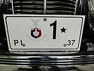 The president's car carries a license plate that bears the number one.