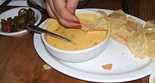 Chili con queso with tortilla chips