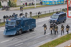 Approaching internal troopers supported by water cannon and assault van with a gunner. Minsk, 15 November