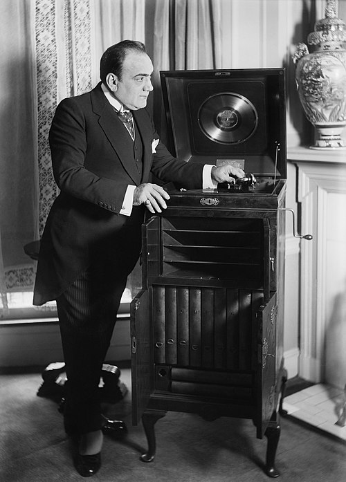Enrico Caruso, with a phonograph