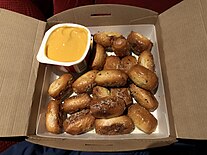 Pretzel bites with a commercial cheese sauce at a movie theater in the United States