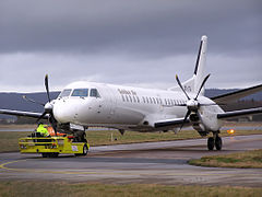 A Saab 2000 being towed by a small tow tractor at Ängelholm-Helsingborg Airport