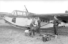 a black and white photograph of a wide-bodied military glider