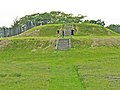 Image 31The largest platform mound at Aztalan, with modern reconstructions of steps and stockade (from History of Wisconsin)