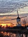 Le moulin à vent Schellemolen au coucher du soleil