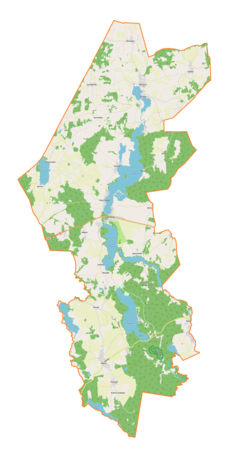 Mapa konturowa gminy Sorkwity, w centrum znajduje się owalna plamka nieco zaostrzona i wystająca na lewo w swoim dolnym rogu z opisem „Lampasz”