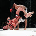 Image 47MMA fighter attempts a Triangle-Armbar submission on his opponent. (from Mixed martial arts)